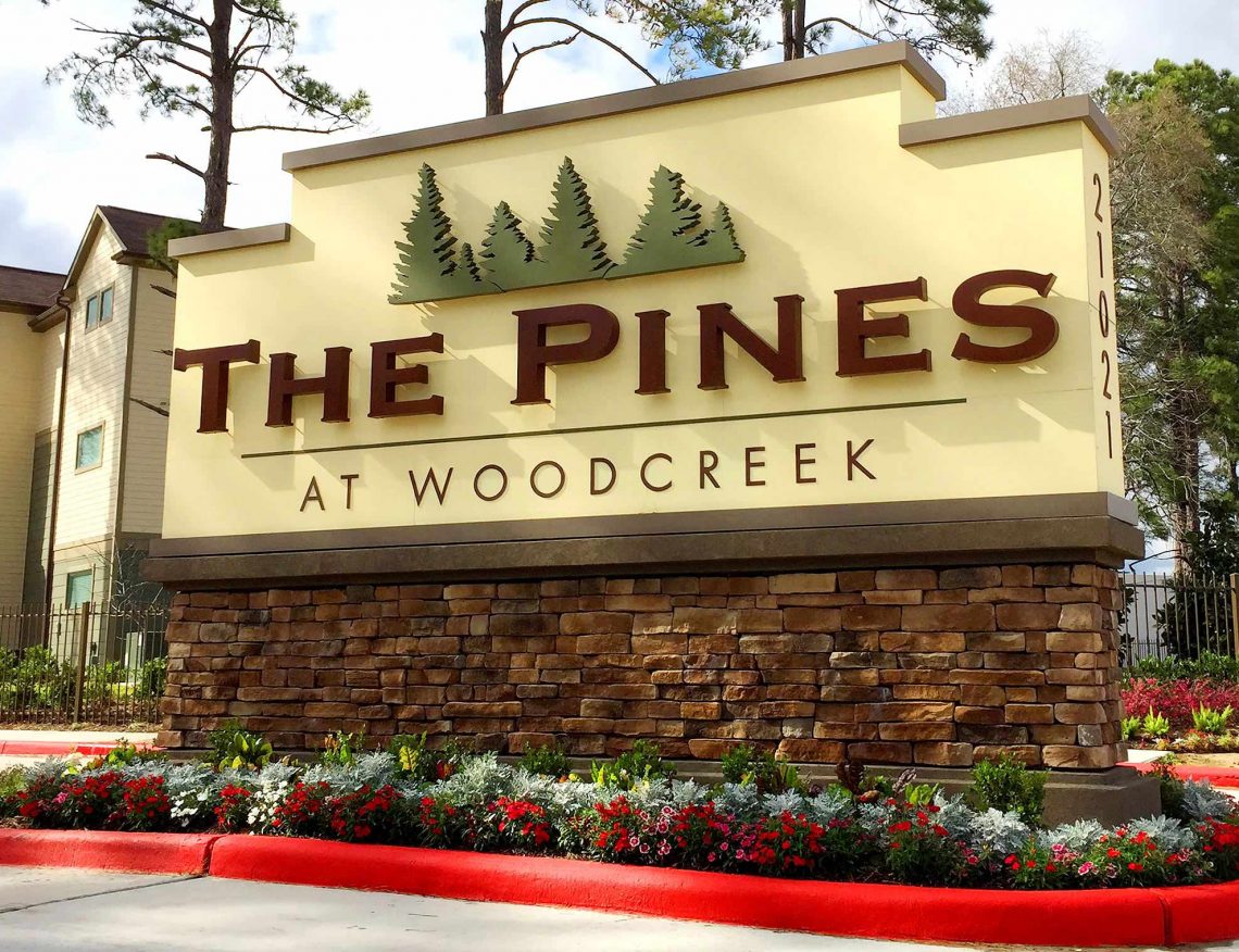 The Pines at Woodcreek Apartments LED Illuminated Monument on Masonry Base